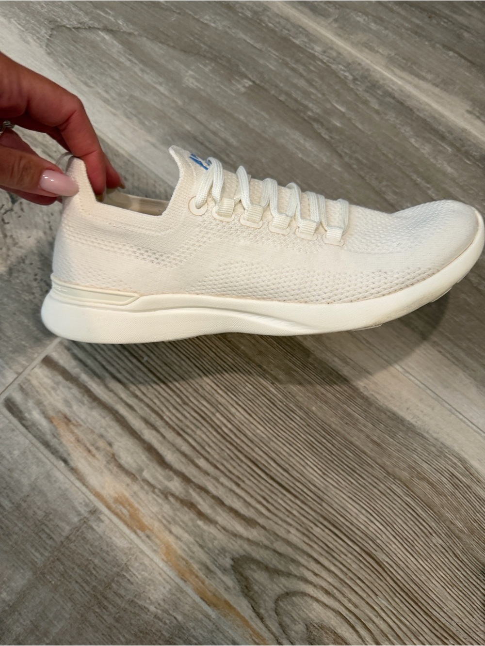 APL Women's techloom Sneakers in white with Blue Logo
